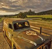 late 1900's work truck rusted with stylish GunBun logo painted on hood