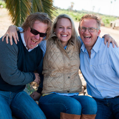 Family siblings sitting and laughing with each other