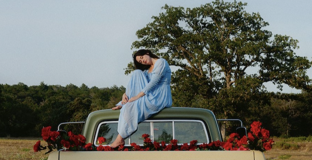 Woman on a truck with flowers