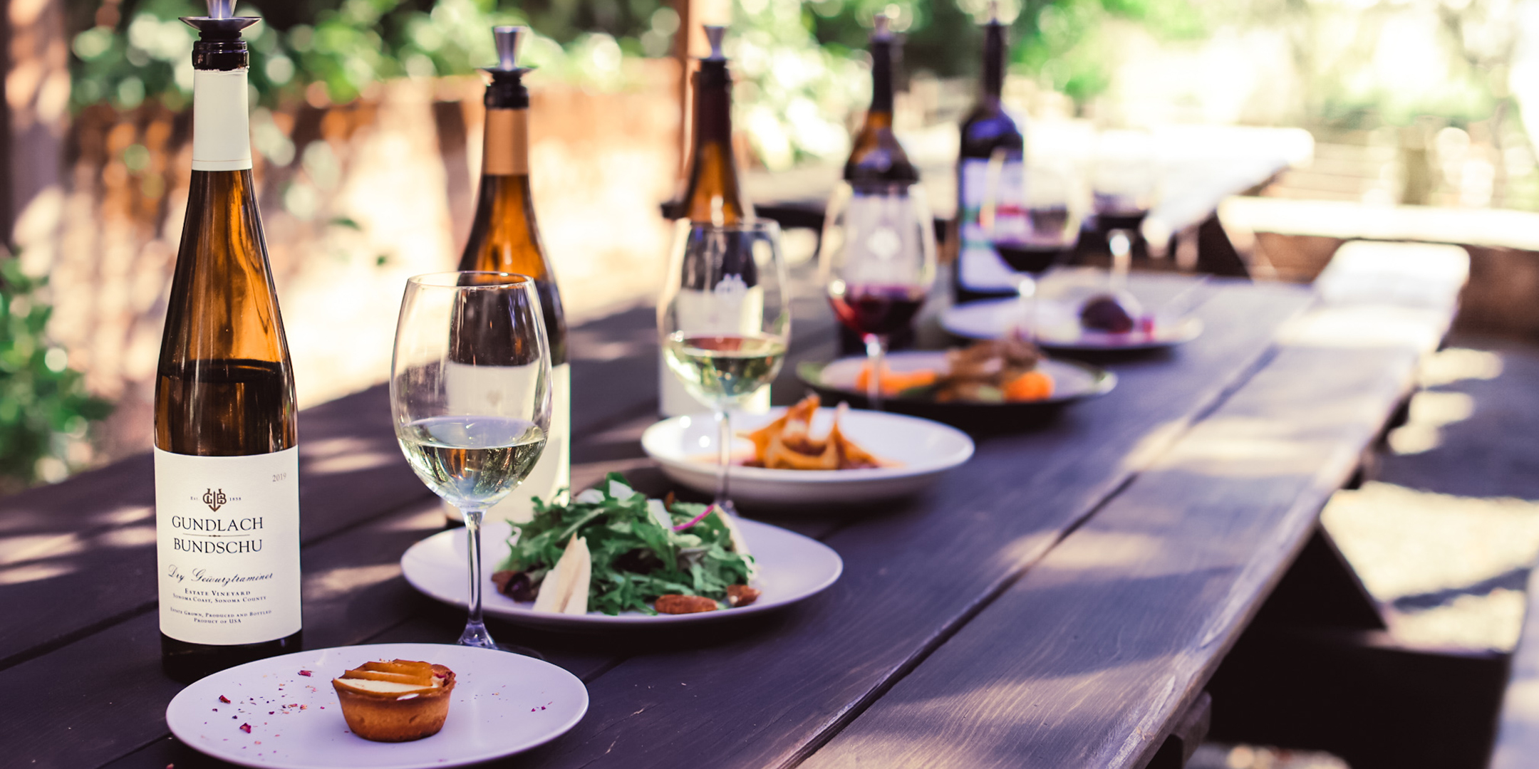 Wines and food on table